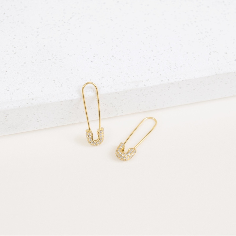 Gold safety pin rhinestone earrings.